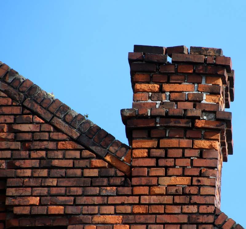 Signs Your Glen Arm Home Needs a Chimney Inspection Damaged chimney on an Glen Arm home showing cracks and missing mortar